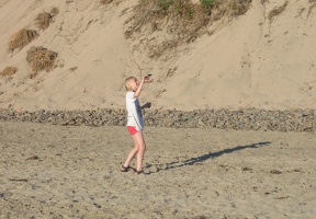 Johanna flying a kite at Cape Lookout State Park